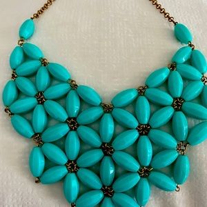 Costume turquoise necklace. Great to wear under a blazer/on a black turtleneck.